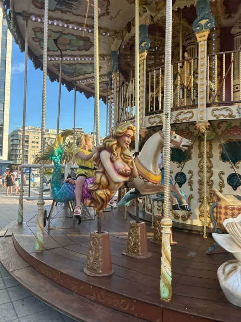 Traditional carousel in San Sebastián with children
