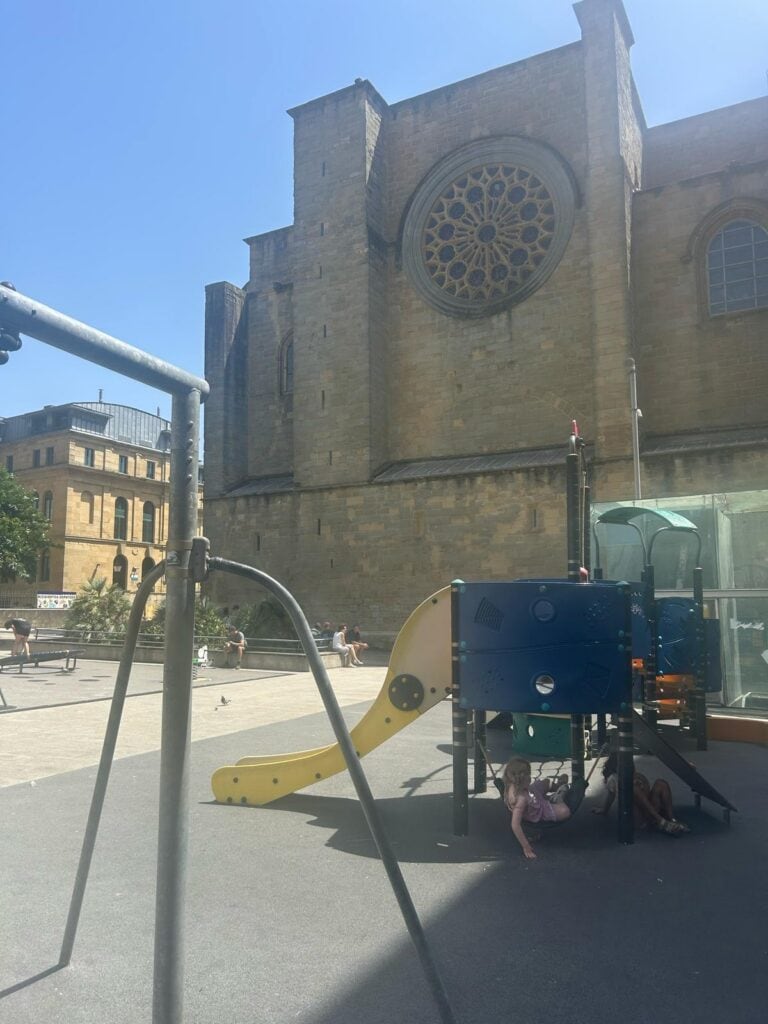 Children’s playground beside historic architecture in San Sebastián