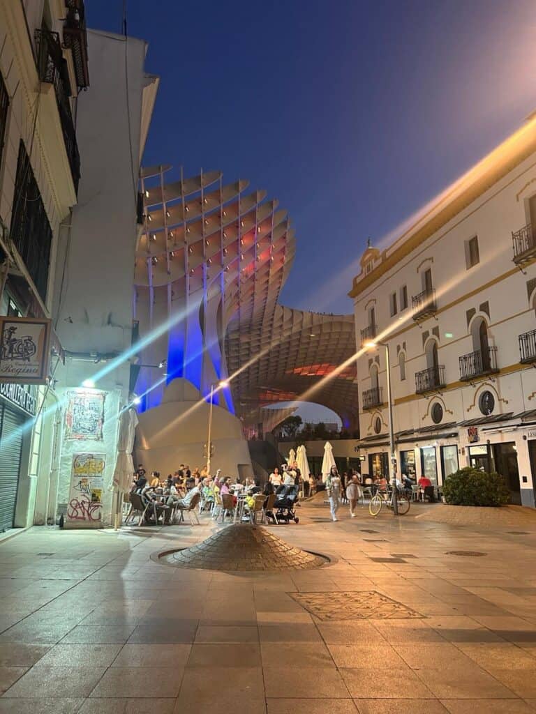 View of the illuminated Setas from La Santa in Seville