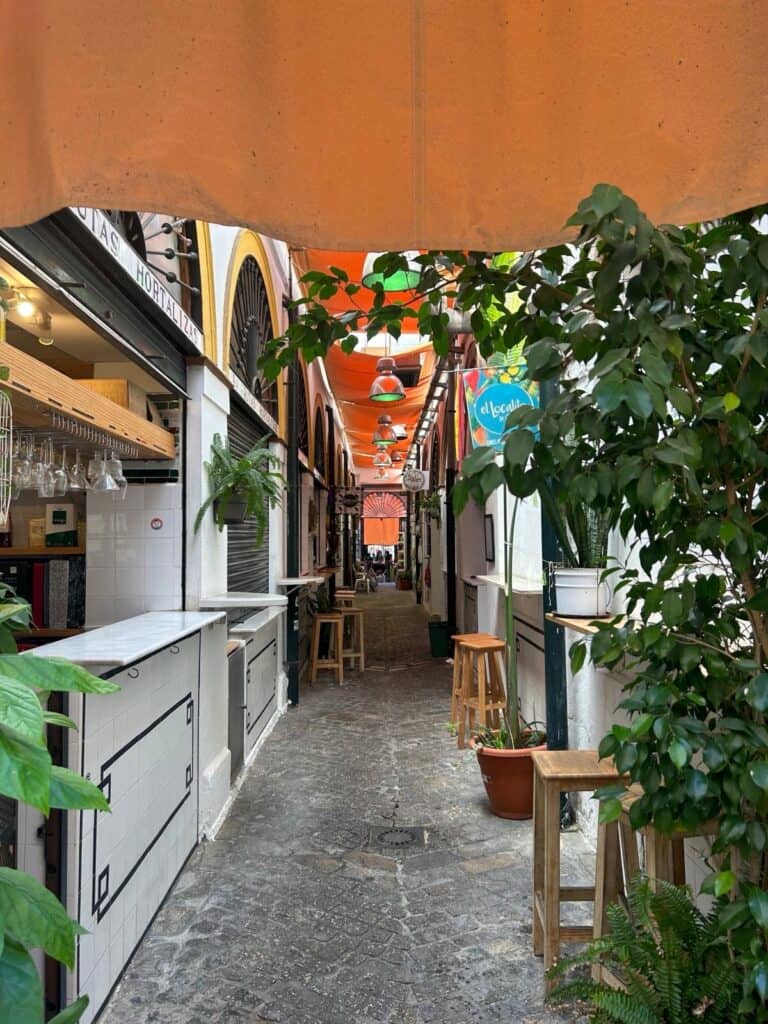 Food stalls inside a traditional market in Seville