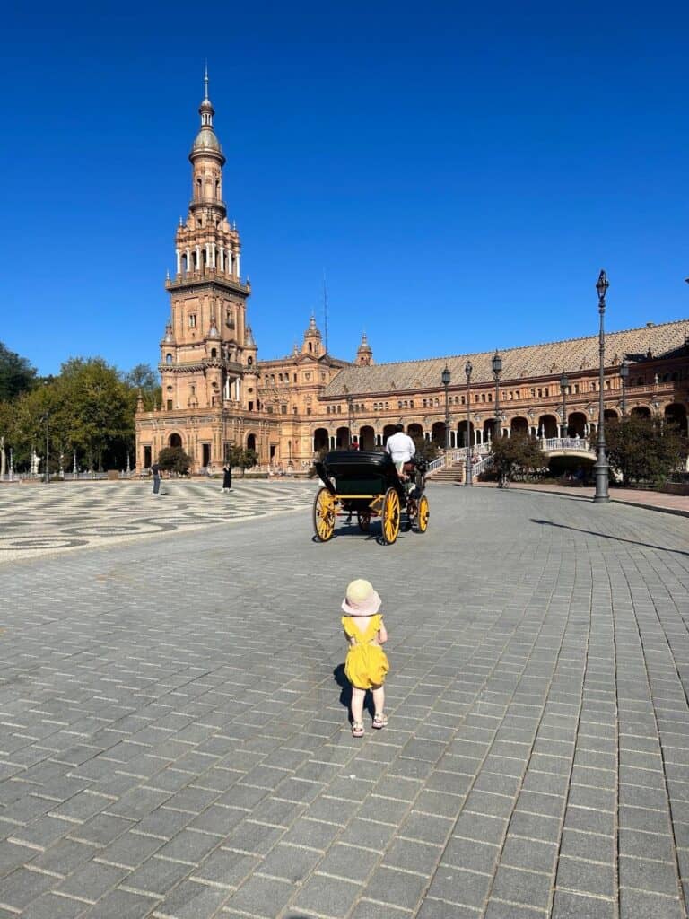 Toddler exploring Plaza de España in Seville